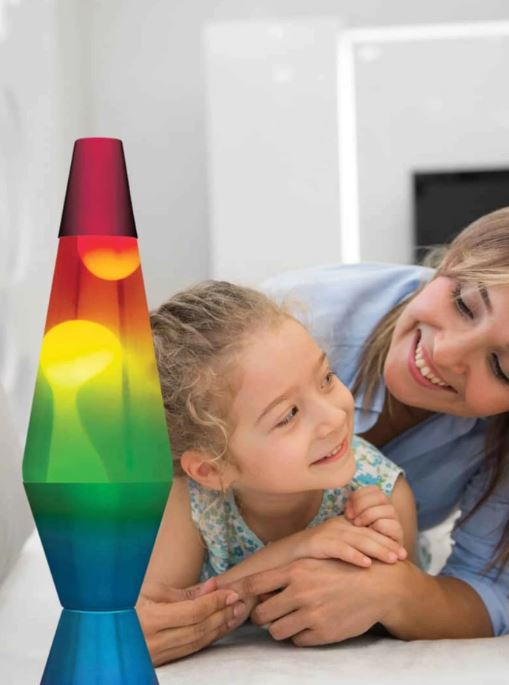 Tapered rainbow lava lamp with yellow wax blobs, watched by a smiling young girl and woman.