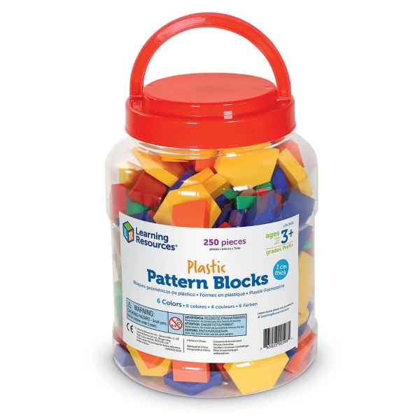 Clear plastic bucket with a red handle filled with colorful yellow, orange, blue, and red geometric pattern blocks.