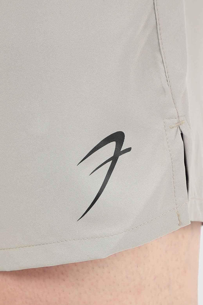 Beige 2-in-1 compression shorts by Fuaark NZ, featuring a snug fit and elastic waistband for active wear and support.