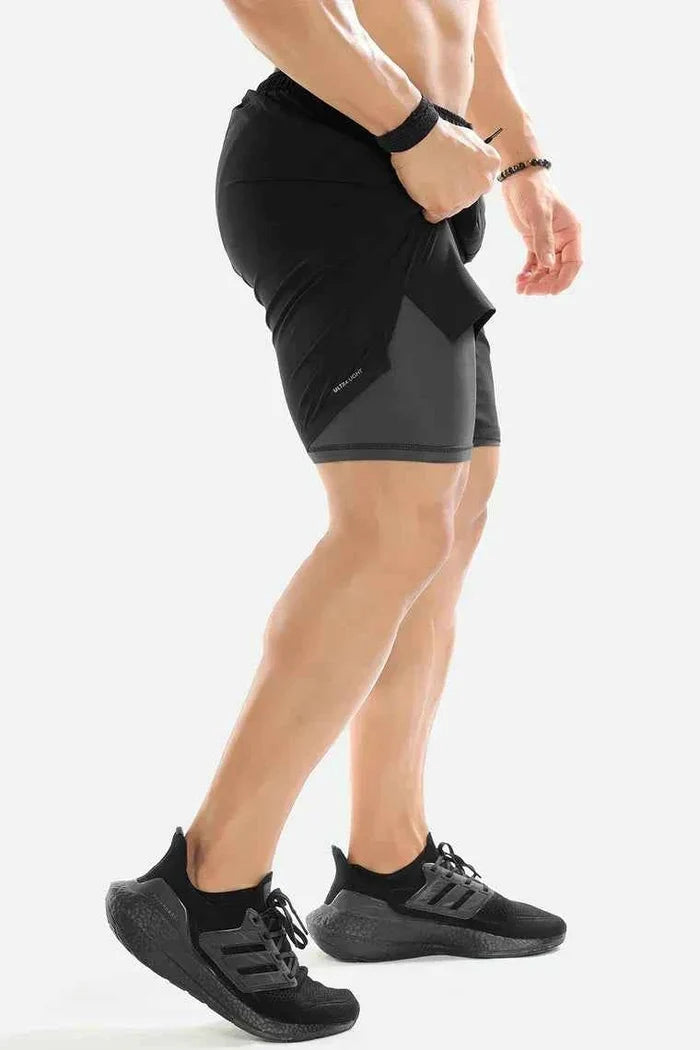 Black 2-in-1 compression shorts by Fuaark Nz, designed for athletic performance and comfort.