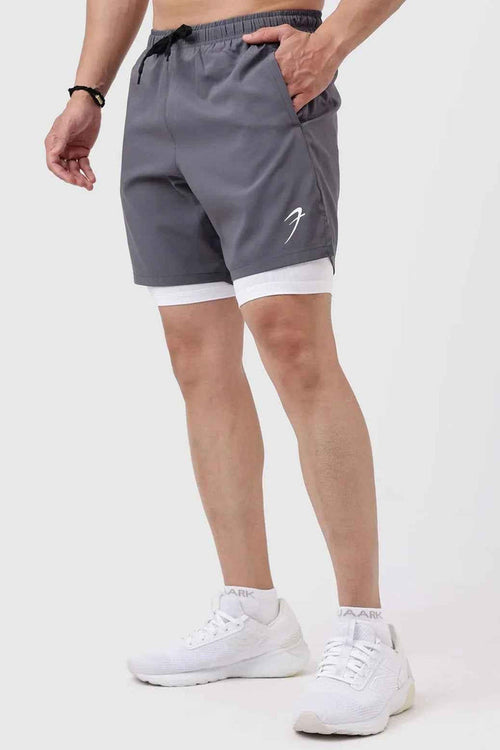 Fuaark Nz 2-in-1 compression shorts in grey with white accents, featuring a snug fit for active wear and athletic support.