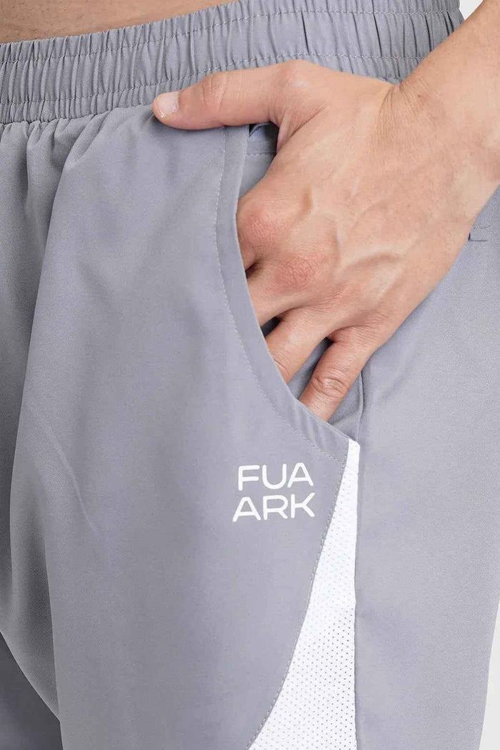 Fuaark NZ 2-in-1 mesh shorts in foggy grey with white accents, featuring lightweight breathable fabric and sporty design.