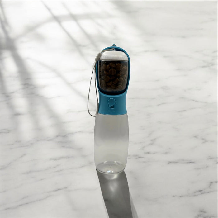 DogTreatNZ 2-in-1 portable pet bowl and bottle with food compartment, compact design for outdoor pet feeding.