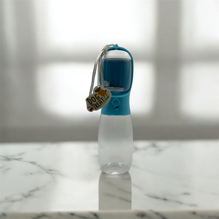DogTreatNZ 2-in-1 portable pet bowl and water bottle with food compartment, compact travel essentials for dogs.