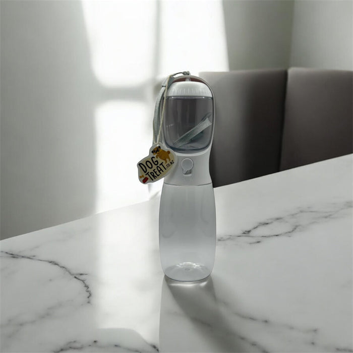 Portable 2-in-1 pet bowl and bottle with food compartment by DogTreatNZ, featuring a compact design for on-the-go pet feeding.