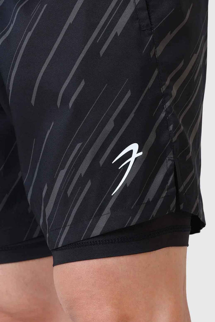 Black 2-in-1 printed compression shorts by Fuaark Nz, featuring a stylish design and flexible fit for active wear.