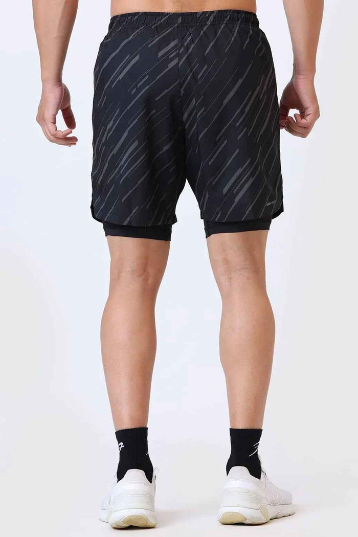 Black 2-in-1 printed compression shorts by Fuaark Nz, featuring a stretchy, comfortable fit for active wear.