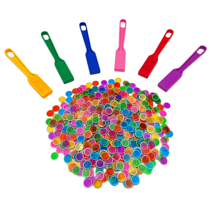 Six colorful magnetic wands fanned out above a large pile of translucent, metal-rimmed circular chips.
