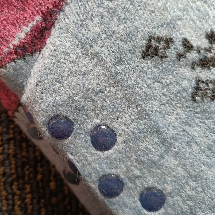 Pair of dealonlinenz kids fuzzy slipper socks with grippers, featuring soft, warm fabric and colorful winter patterns for children.