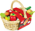 Woven wicker basket with colorful wooden toy produce, featuring a red Janod brand sleeve and a large handle.