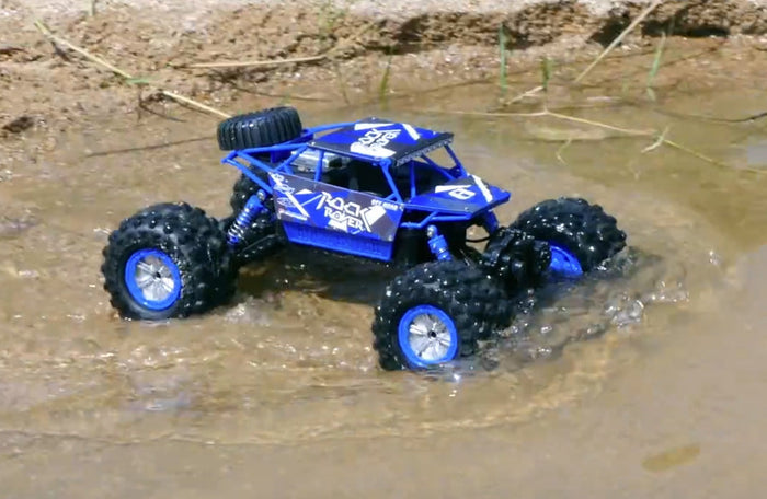 Bright yellow 2.4G 4WD amphibious RC crawler buggy car on rugged terrain, showcasing off-road capabilities and waterproof design.
