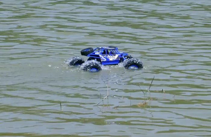 Dealonlinenz 2.4G 4WD amphibious crawler RC buggy car on rugged terrain, showcasing its waterproof design and off-road capabilities.