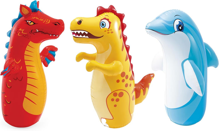 Three colorful inflatable bop bags shaped like a red dragon, a yellow dinosaur, and a blue dolphin.