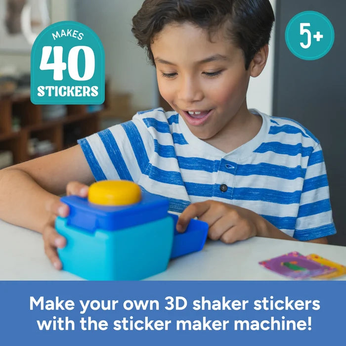 A smiling boy uses a blue and teal toy machine with a yellow button. Text: Makes 40 Stickers and 5 plus.