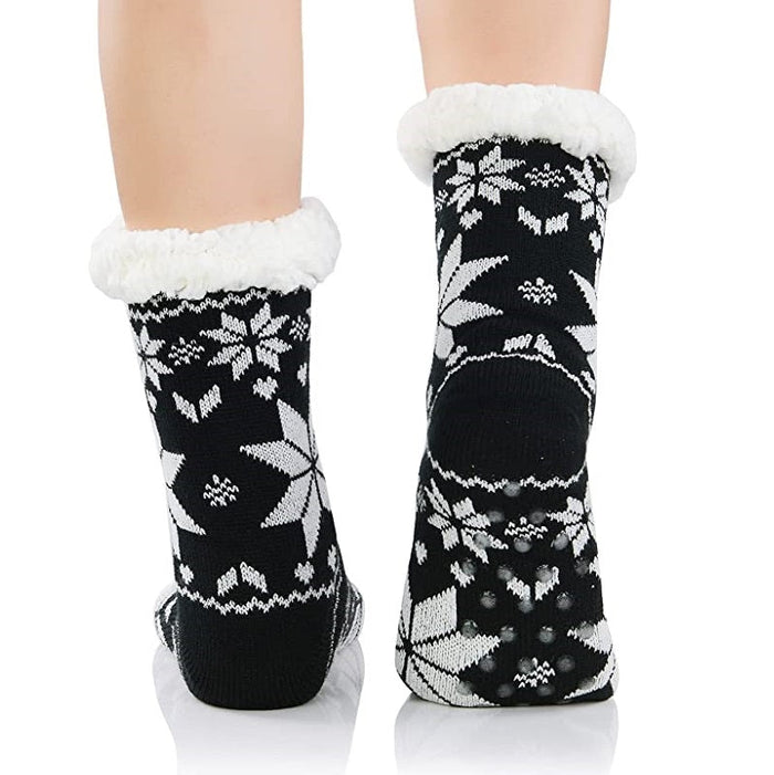 Four pairs of fuzzy women's winter slippers with soft fabric and gripper soles, stylish and cozy for cold weather.
