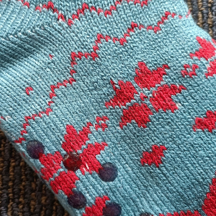 Four pairs of women's fuzzy slipper socks from dealonlinenz, featuring soft material and grippers for winter warmth and comfort.
