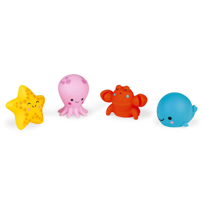 Four colorful bath toys: a yellow starfish, pink octopus, orange crab, and blue whale with smiling faces.