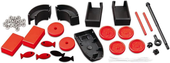 Assorted red and black plastic parts, silver nuts, and fish shapes for a magnet science experiment kit.