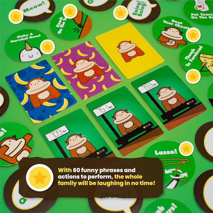 Colorful cards showing gorillas on scales, action tokens, and gold star pieces spread out on a green background.