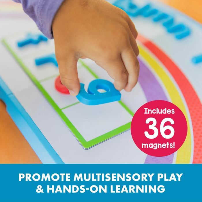 Child placing a blue magnet letter on a rainbow-themed learning mat. Red sticker reads: Includes 36 magnets.