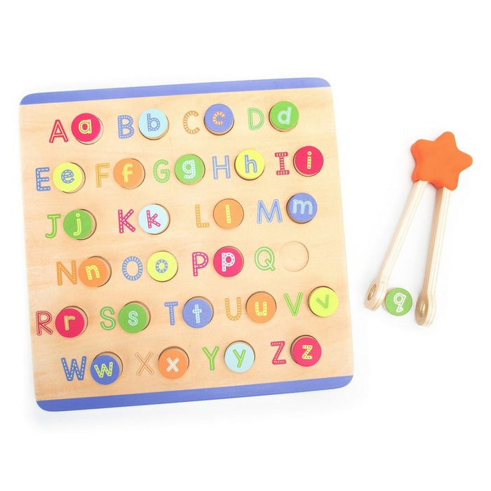 Colorful wooden alphabet puzzle with lowercase letter discs and a star-topped tong picking up the letter q.