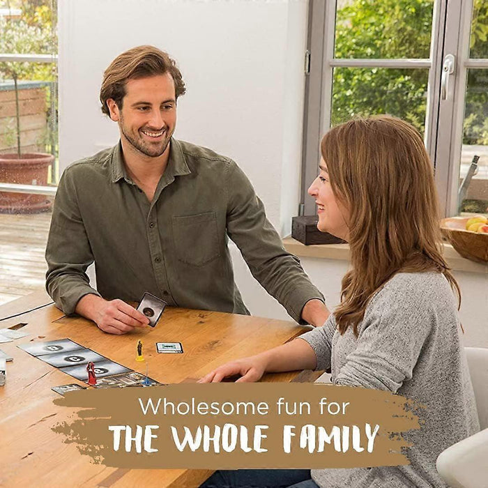 Man and woman smiling while playing a board game with cards and colorful figurines on a wooden table.