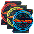 Three large flying rings in orange, yellow, and blue, each on a black retail display card.