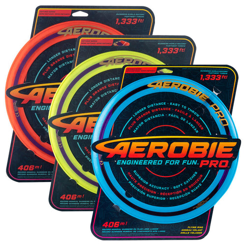 Three large flying rings in orange, yellow, and blue, each on a black retail display card.