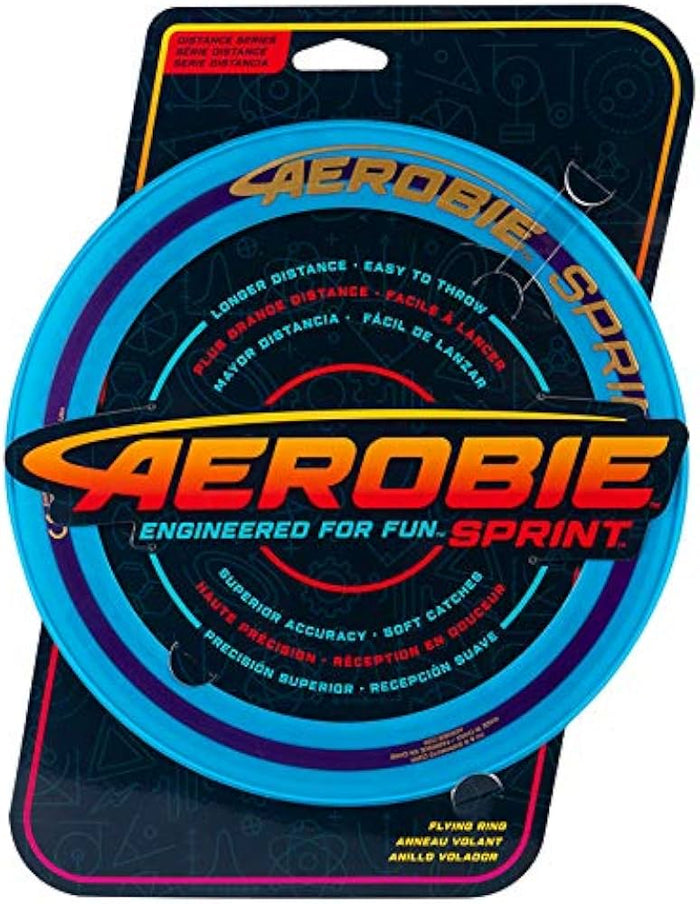 Blue circular flying ring on dark cardboard retail packaging with yellow and red text and geometric patterns.