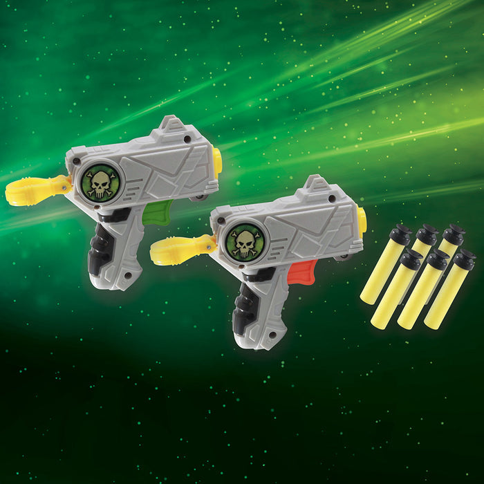 Two grey toy blasters with skull decals and six yellow foam suction darts on a glowing green background.