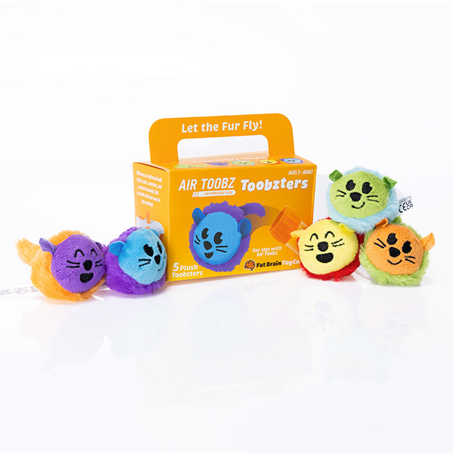 Five colorful round plush animals with whiskers and ears displayed next to their yellow and orange product box.