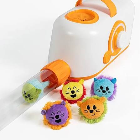 Five colorful fuzzy plush animal faces with manes, one seen inside a clear tube on a white and orange toy.