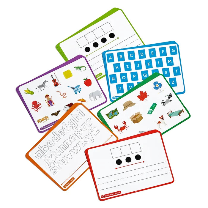 Six colorful mats featuring alphabet letters, sound boxes, and vibrant pictures like a zebra, elephant, and crab.