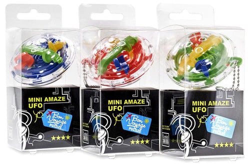 Three disc-shaped 3D maze puzzles in clear boxes with colorful internal tracks and silver keychains.
