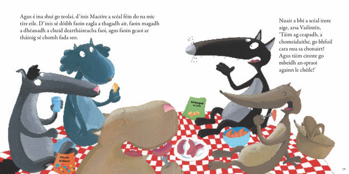 Colorful cartoon wolves sit on a red checkered picnic blanket with food and Irish text on white book pages.