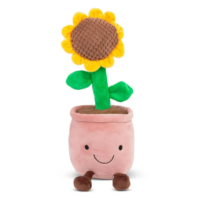 Plush yellow sunflower with a green stem in a smiling pink pot with small brown feet.