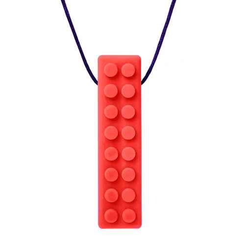Red rectangular chew necklace with raised circular studs on a dark blue cord.
