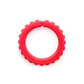 Red circular sensory chew bracelet with textured brick-like bumps on the outer edge and a small gap at the top.
