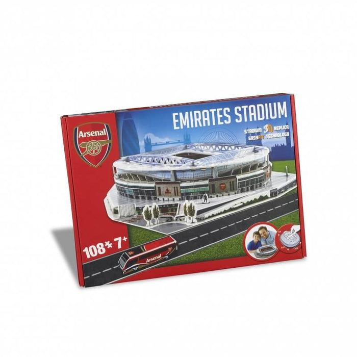 Red box featuring a 3D puzzle of Emirates Stadium, Arsenal logo, and a team bus on a road. 108 pieces, ages 7+.