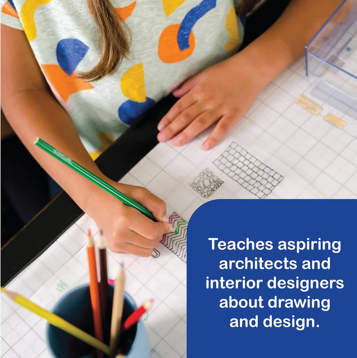 Child sketching architectural patterns on grid paper with a green pencil and a cup of colored pencils nearby.