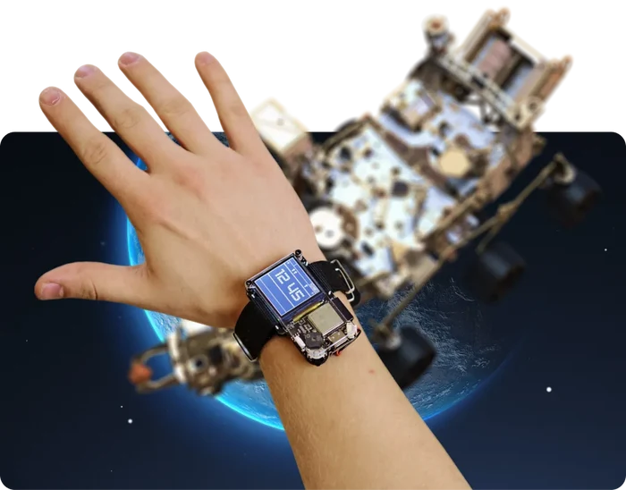 Hand wearing a square smartwatch with an exposed circuit board and blue screen against a space-themed background.