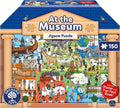 Colorful museum-shaped 150-piece jigsaw puzzle box illustrating a busy museum interior with dinosaurs and exhibits.