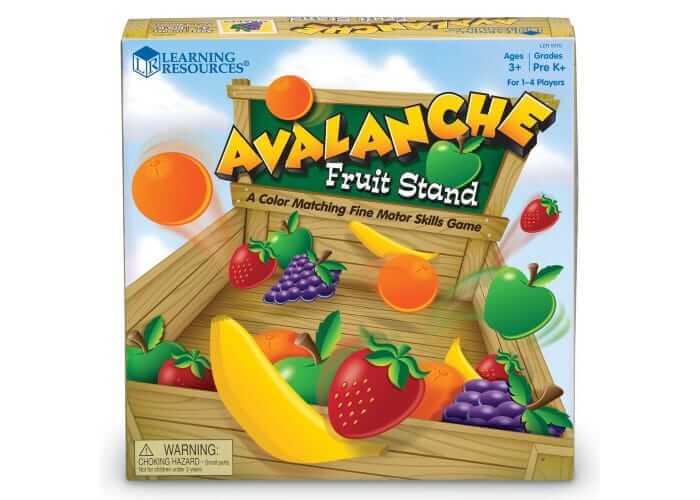 Colorful game box for Avalanche Fruit Stand with illustrated fruit falling into a wooden market crate.