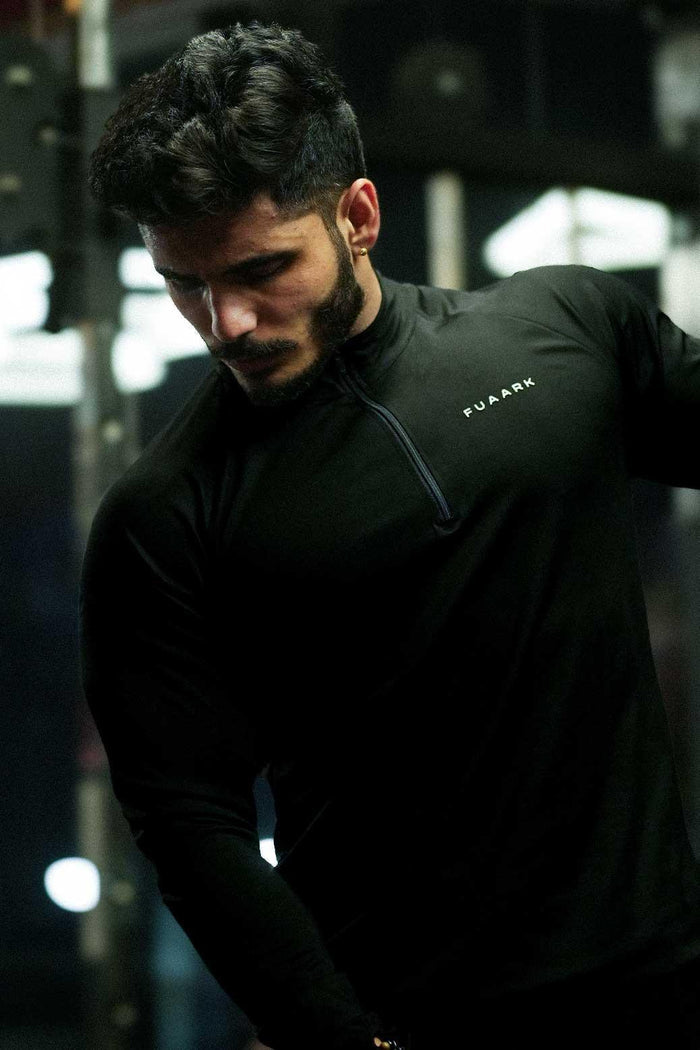 Black Axis Pullover T-shirt by Fuaark Nz, showing a casual fit with a round neckline and minimal branding.
