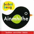 Irish board book cover featuring a large black bird with a green wing and orange beak on a white background.