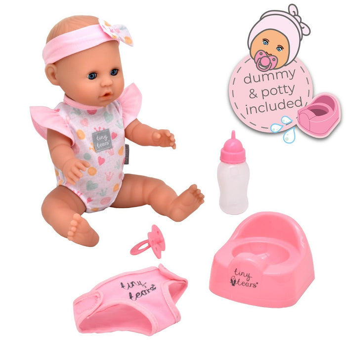 Blue-eyed baby doll in a pink romper and headband with a matching pink potty, bottle, dummy, and cloth diaper.