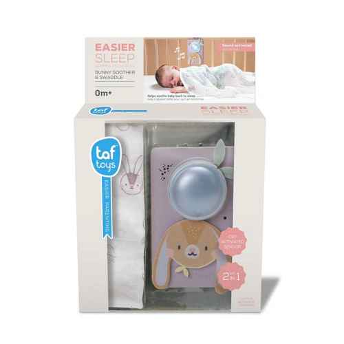 Boxed set containing a white bunny-print swaddle and a lilac bunny-shaped sound machine with a large light-up center.