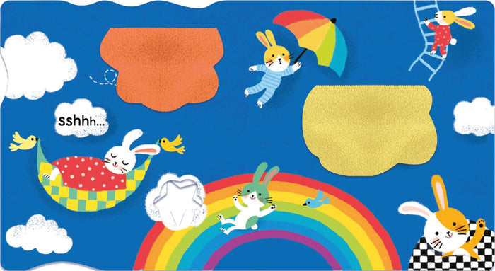 Colorful blue illustration featuring bunnies on a rainbow, in a hammock, and floating with an umbrella among clouds.