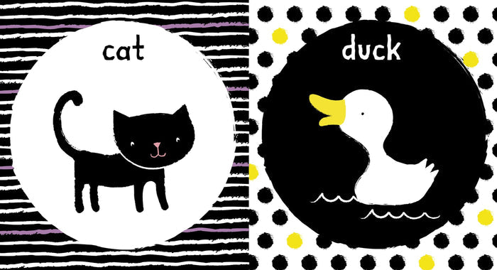 High-contrast illustrations of a black cat and white duck on striped and polka-dotted backgrounds.