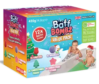 Colorful box of 12 Christmas bath bombs in Santa, star, and tree shapes, featuring kids playing in a green bath.